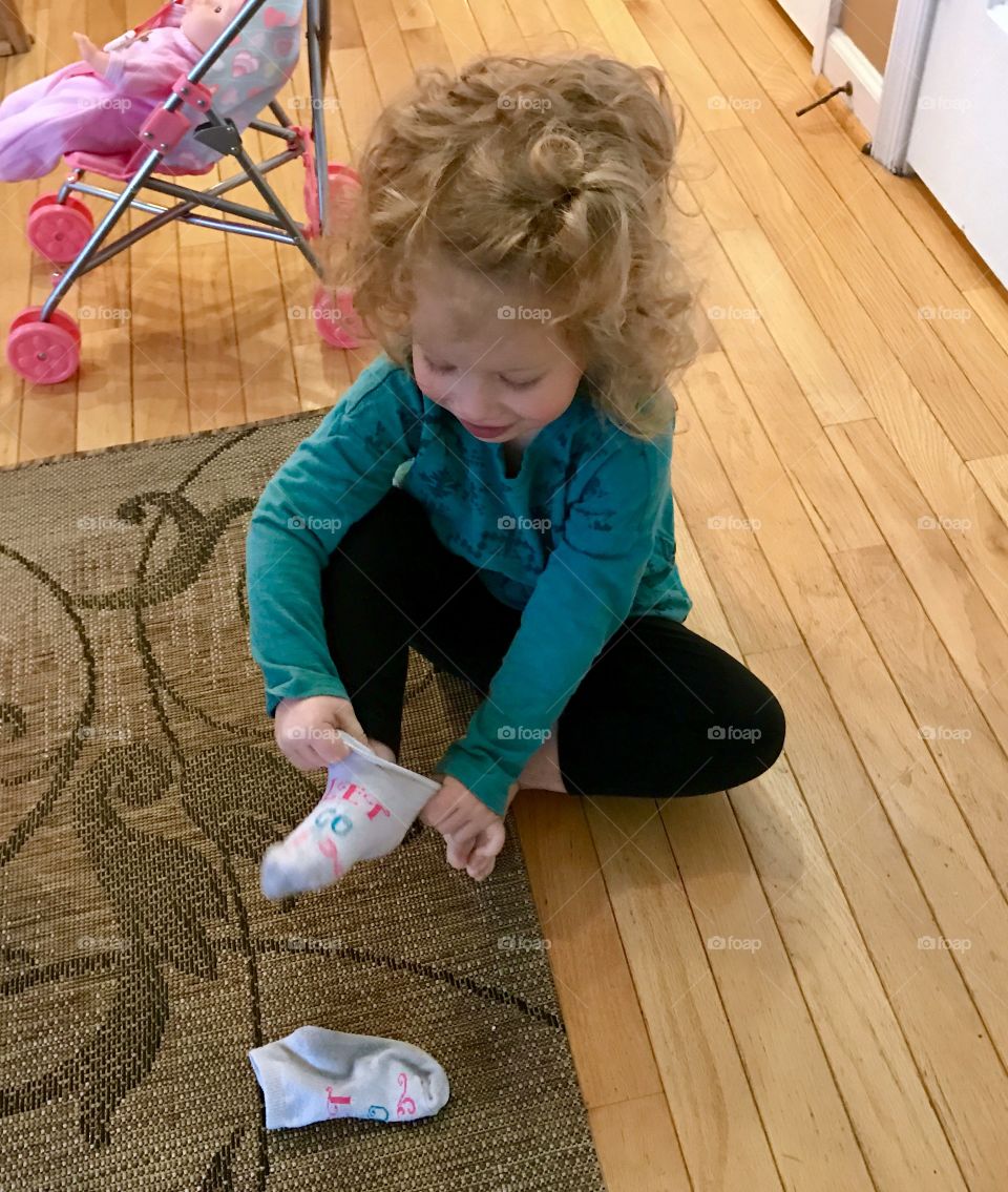 Toddler Putting on Socks