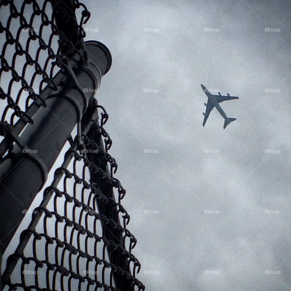 Airplane. Plane & Cyclone Fence