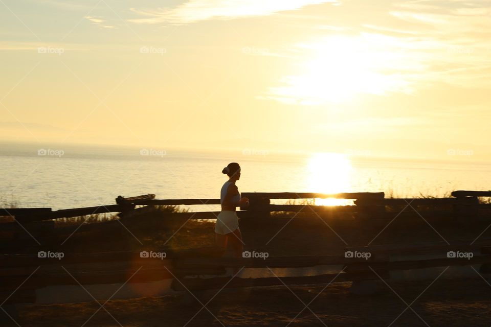 Woman running insunset