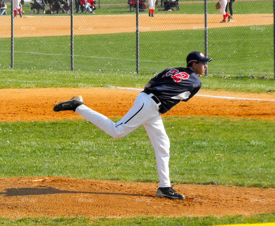 high school pitcher. high school pitcher throws from the mound