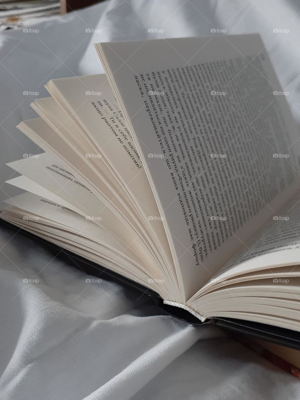 An open book on a white background