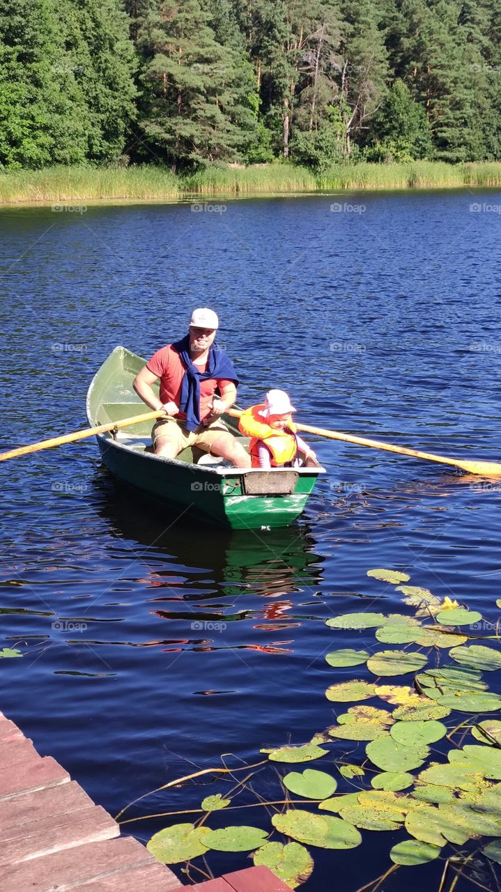 father and daughter on a boat