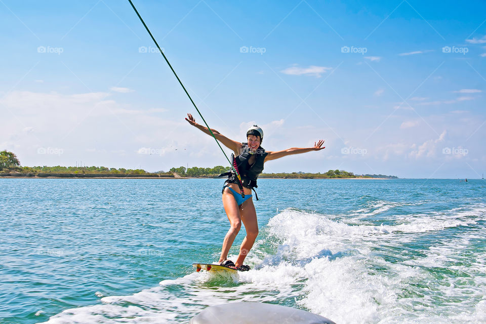 A woman wakeboarding in Bali.
