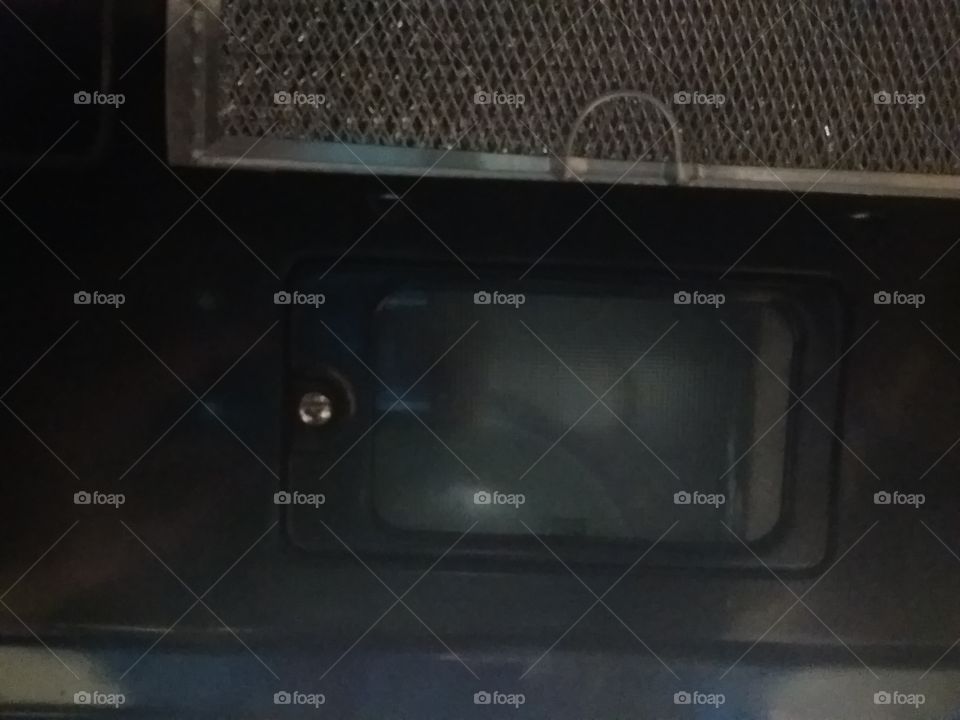range light from the bottom of an over range microwave oven