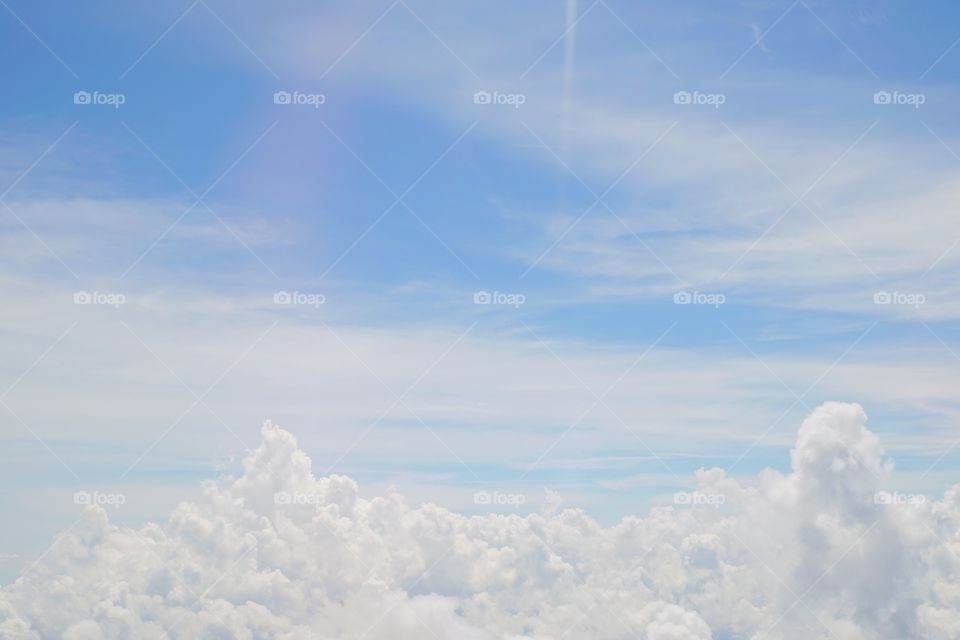 Cloudscape. View from airplane window flying above the cloud.