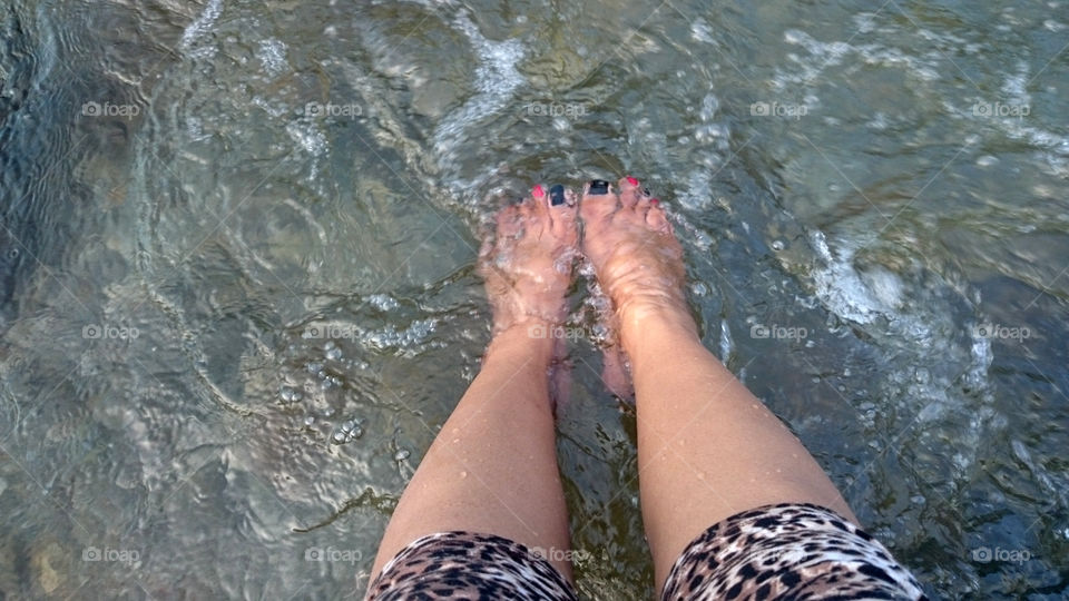 feet in the river