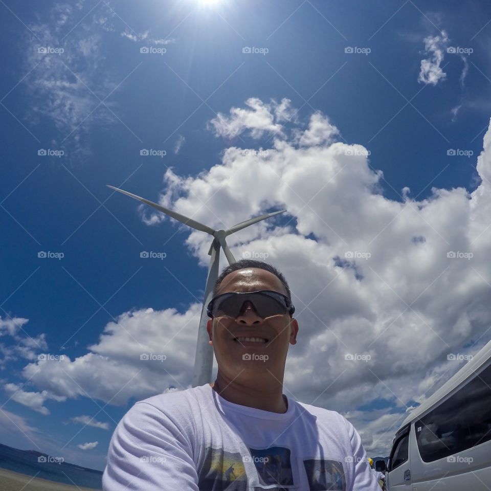 Wind Mills, Blues Skies and White Clouds Background, Selfie alone..
