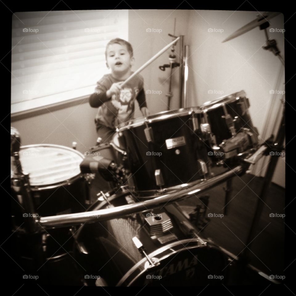 Rocking Out. Patrick learning how to play the drums