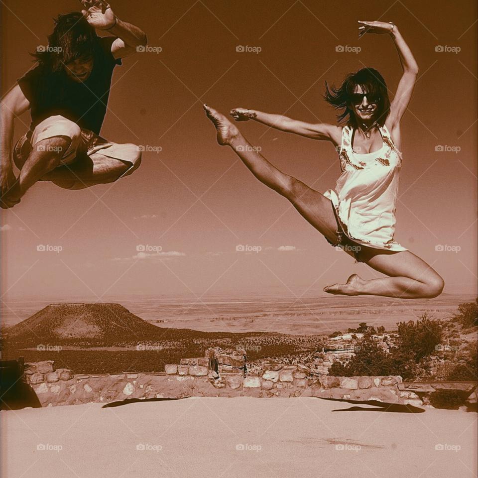 A match made in heaven . A husband and wife jump at Grand Canyon 