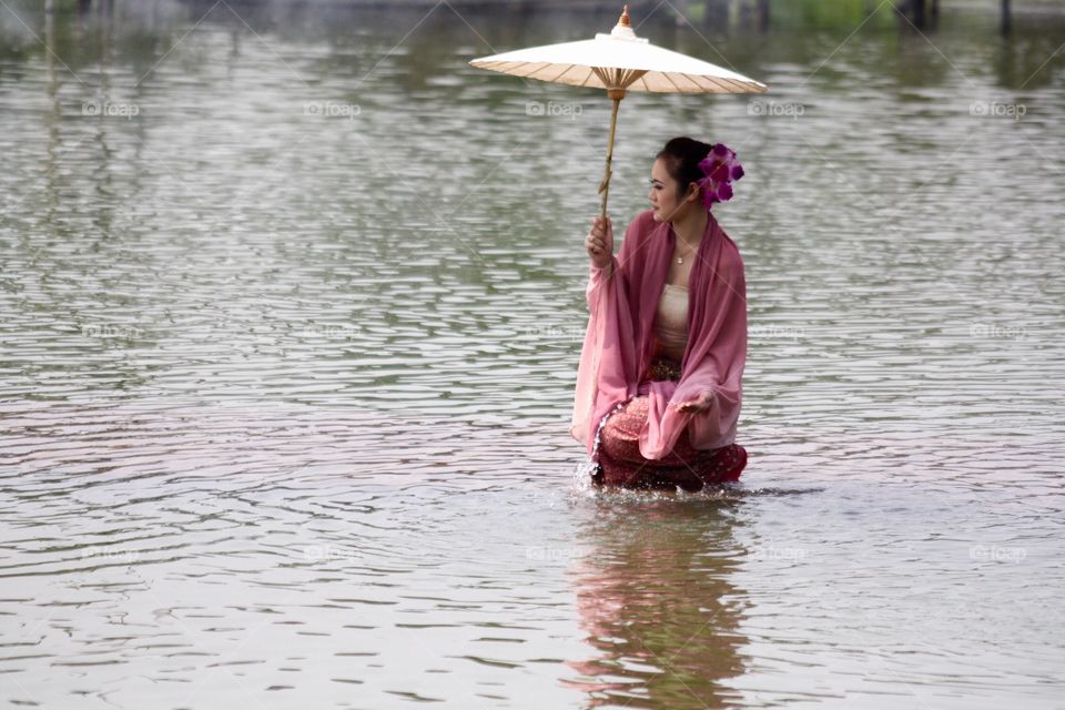 Women at river, Thailand 
