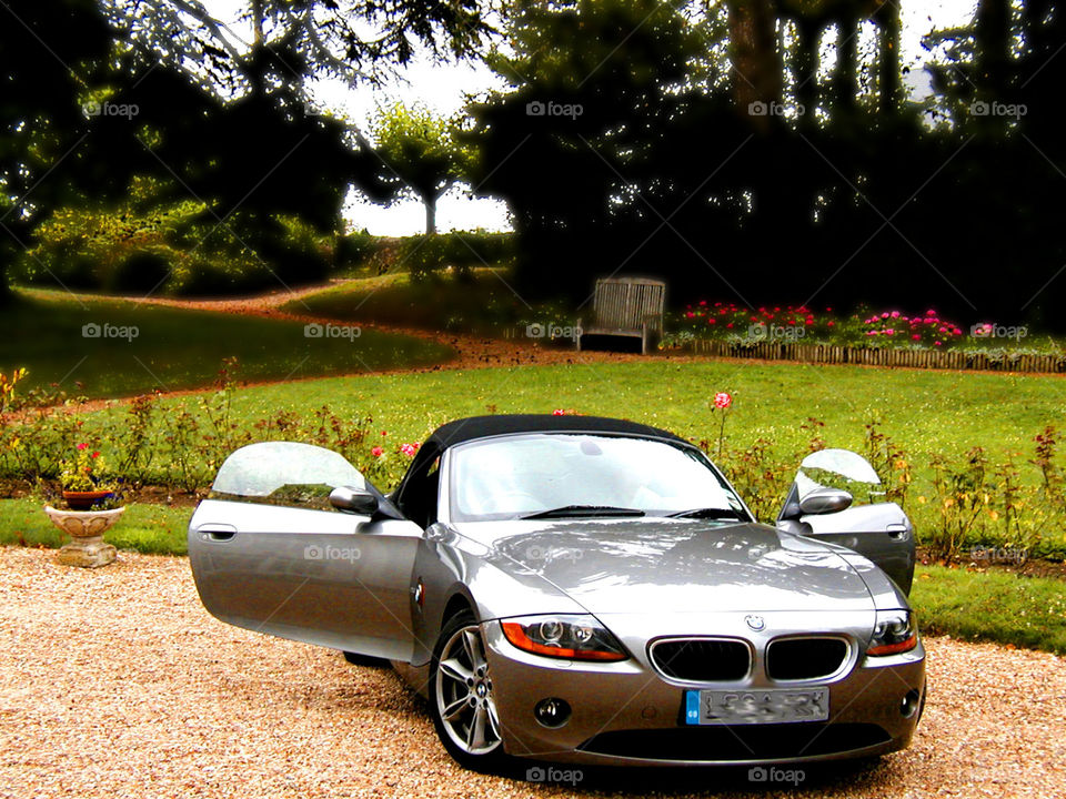 A BMW . In the south of France a beautiful silver BMW waits for its owners with its doors open