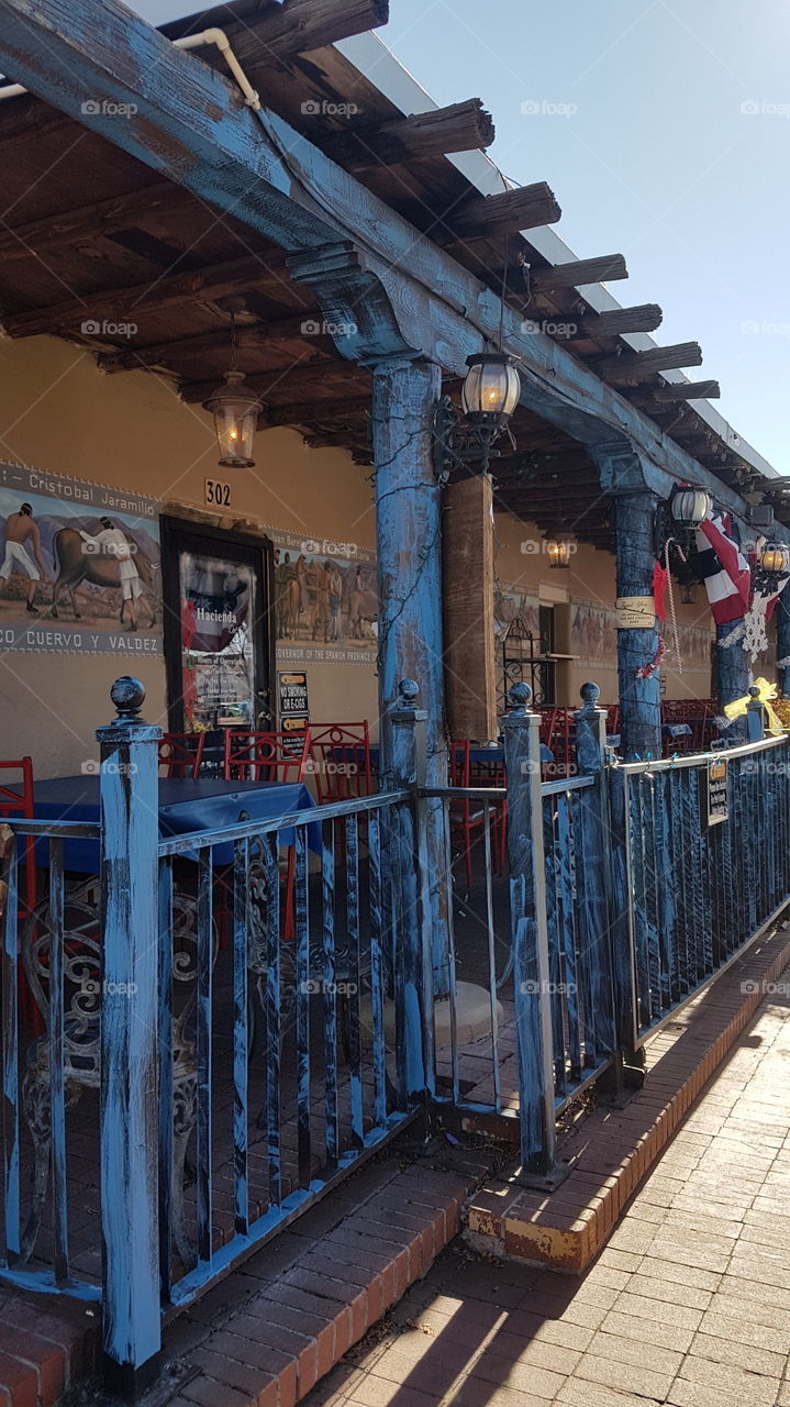 Blue patio of a restaurant in thw square of the old town of Alburquerque, New Mexico, USA.