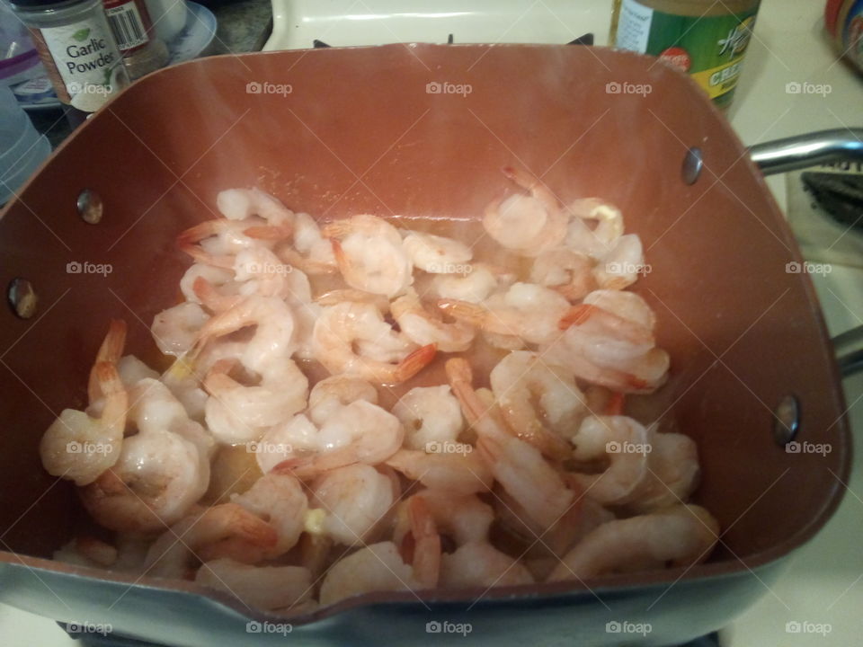 shrimp sauteed in butter and garlic with a side of cocktail sauce. mmm good stuff.