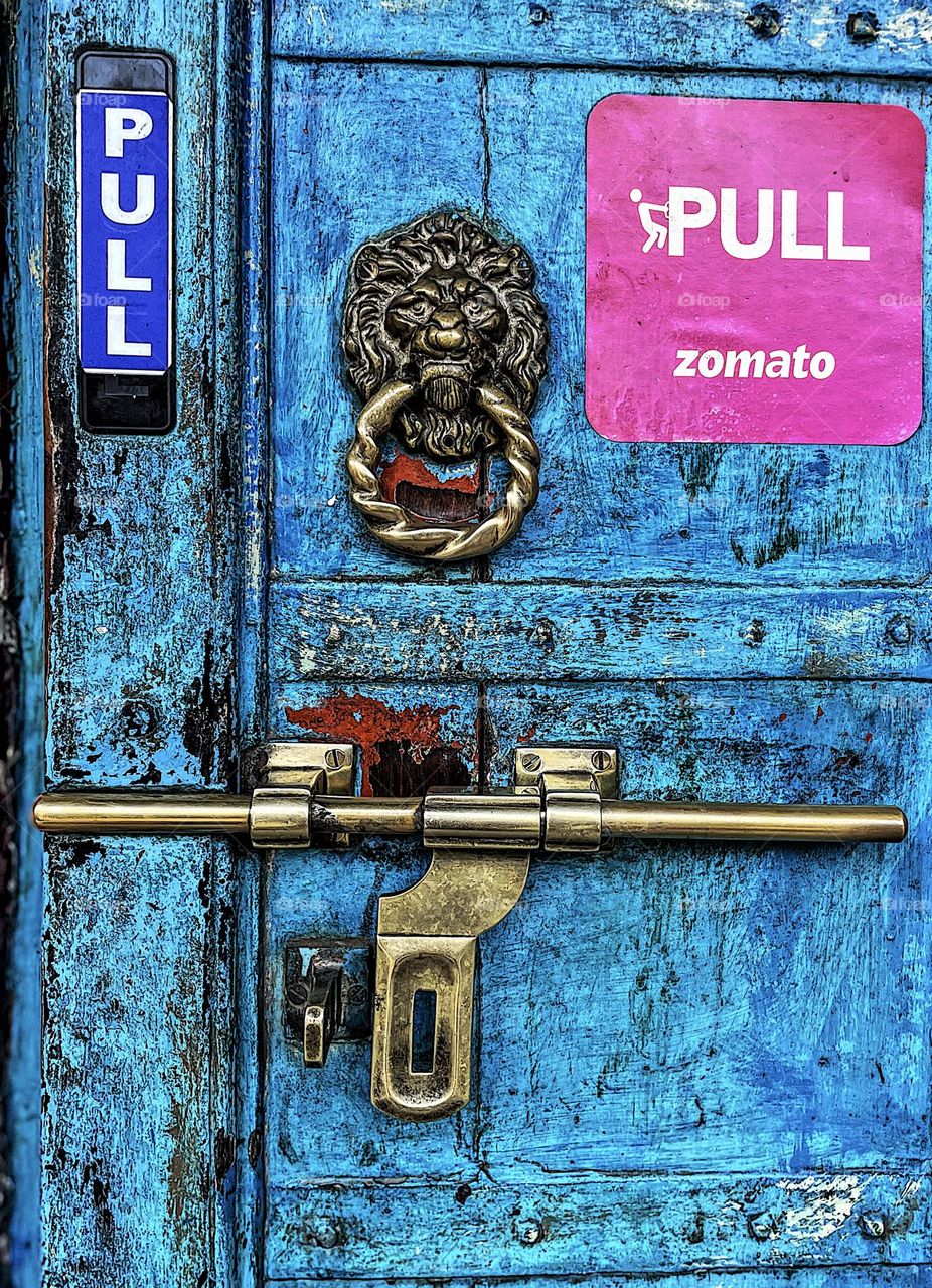 Bright blue door, doors of India, door to a restaurant in India, gold and blue door in India, entryways in India 