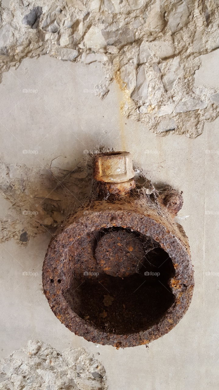 Rusted Pipe and Concrete