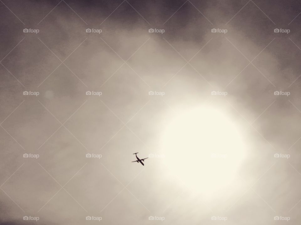 Plane Flying Into Sun