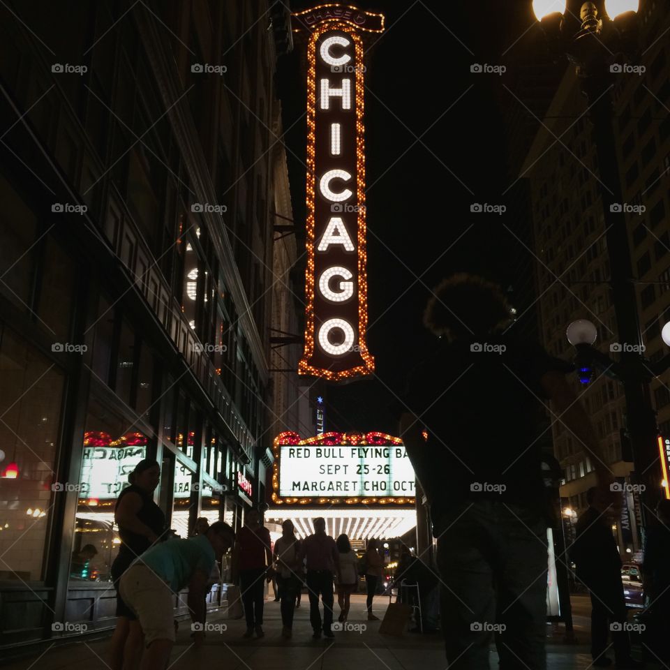 Oh, Chicago. The famous Chicago Theatre sign at night. With my friend Isaiah skateboarding in front.