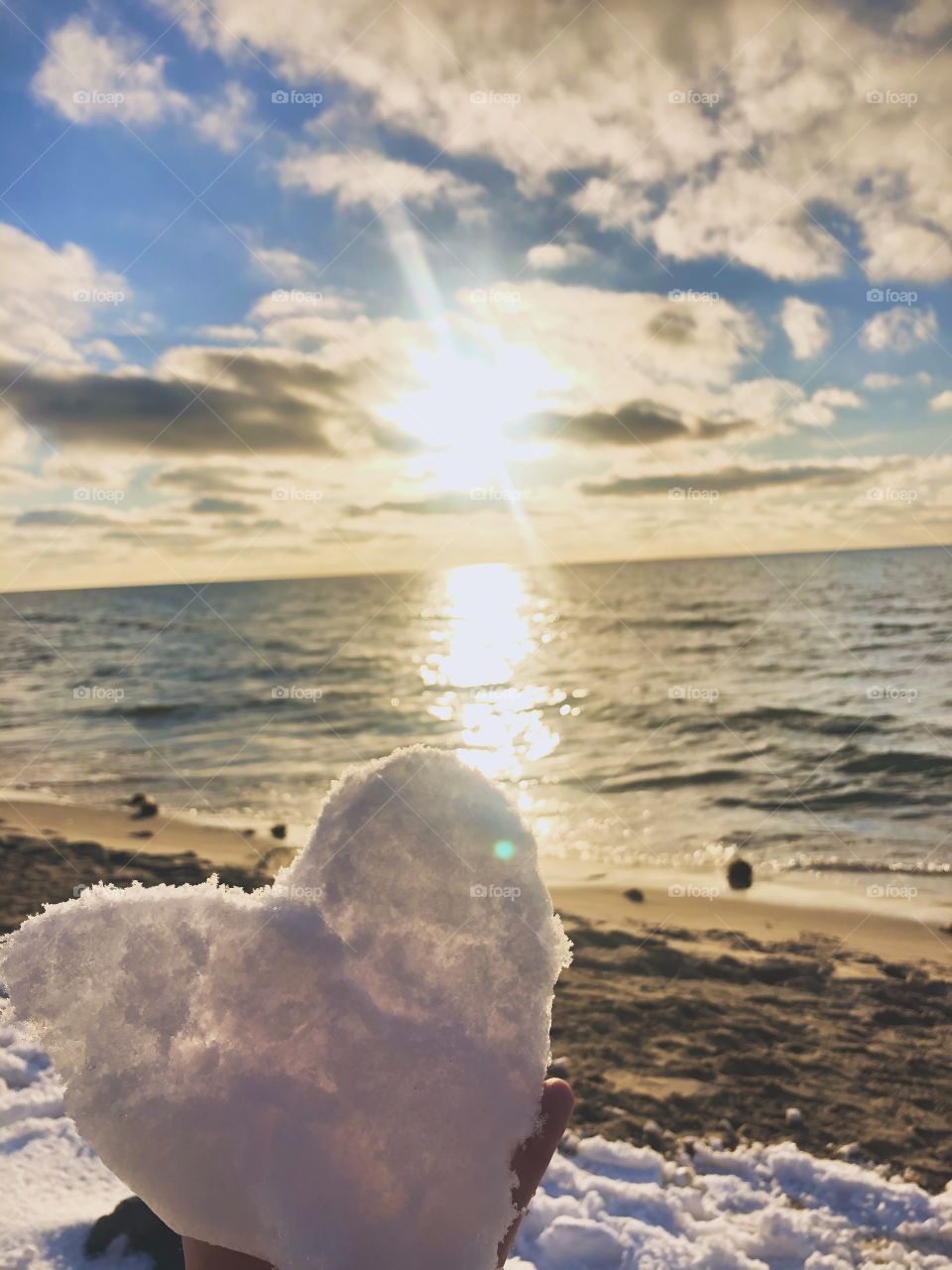 Heart made out of snow at the beach