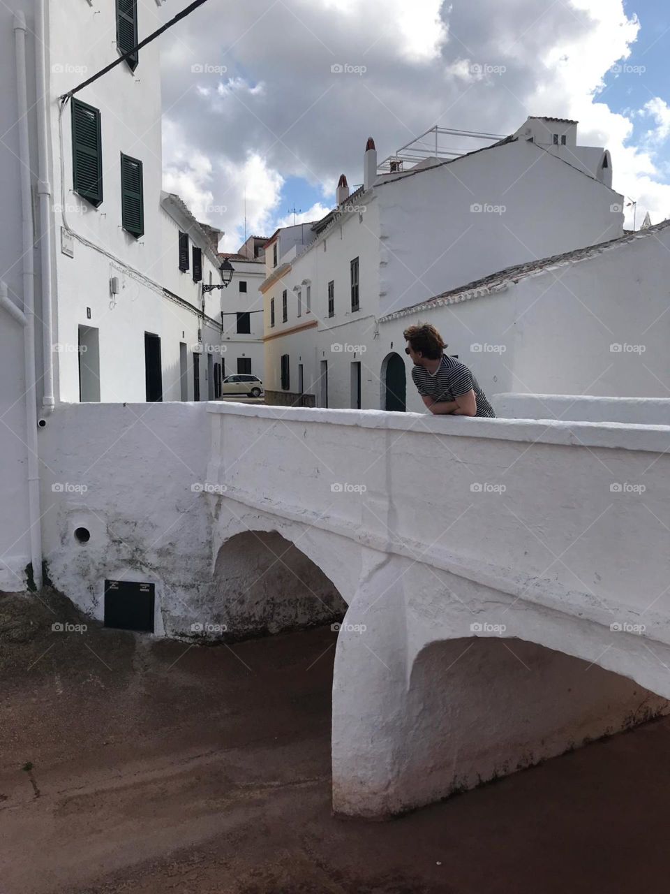 Menorca attractive white washed bridge, houses blend in at the rear of the bridge and appear to close into v point 