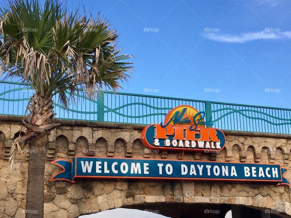 Main Street Pier and Boardwalk sign at entrance to Daytona Beach, Florida 