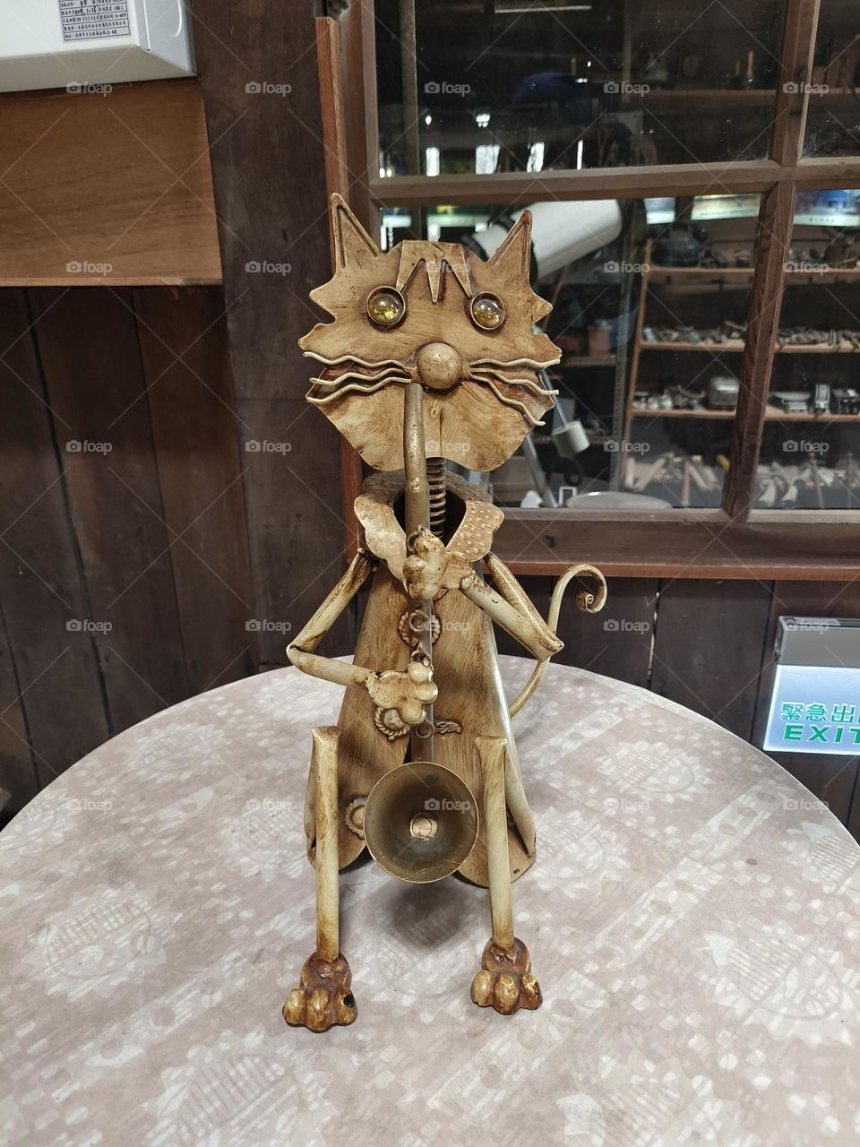 Iron old cat playing saxophone