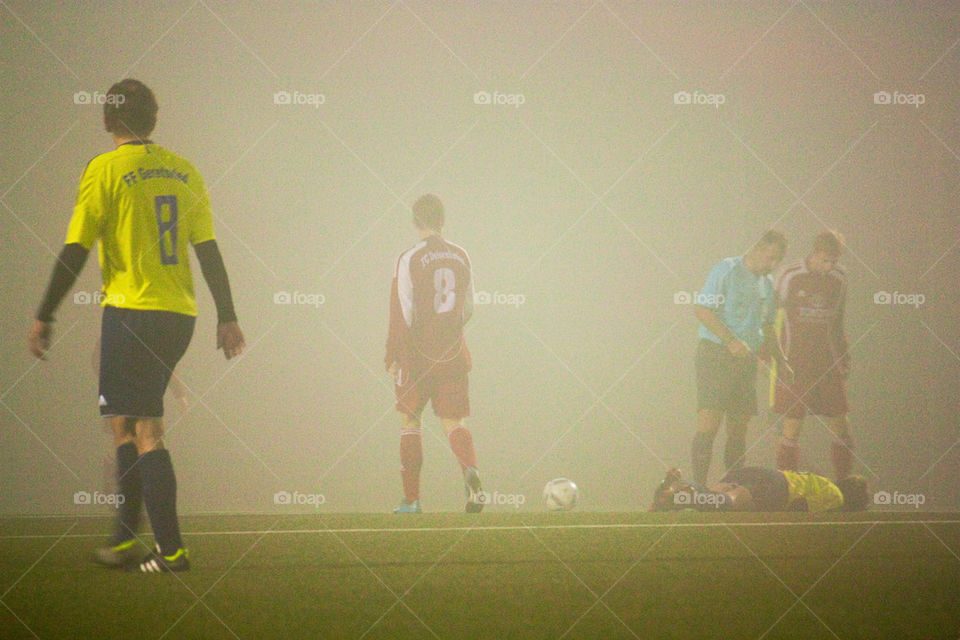 Soccer game in fog