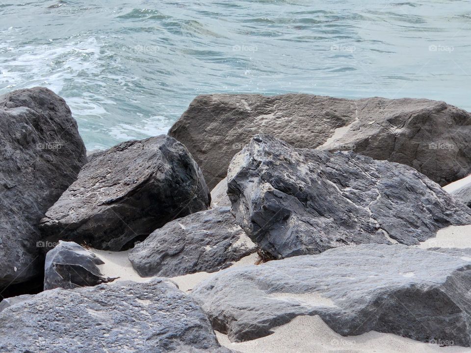 Sharp rocks choppy water