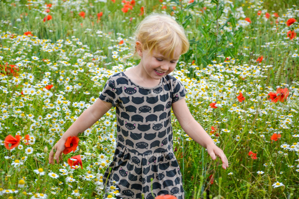 Girl walking in the meadow