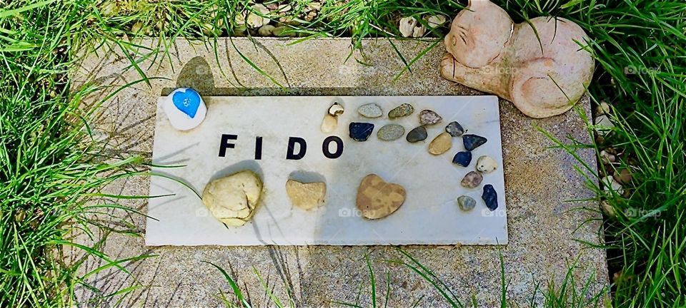 Beneath this stone in the beautiful garden in “Lower Bavaria”, Germany lies “Fido”, the tomcat who passed away two years ago at the age of fifteen. 2024. Hypnotic Productions