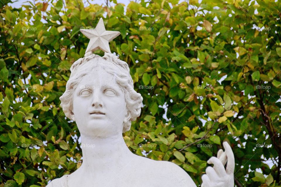 statue of a person in a garden