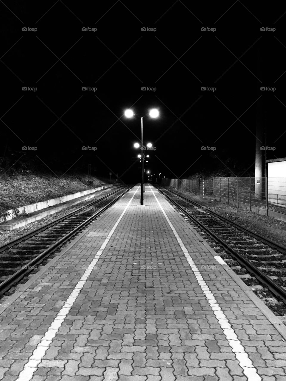Black and White in the Night on the Train Station 
