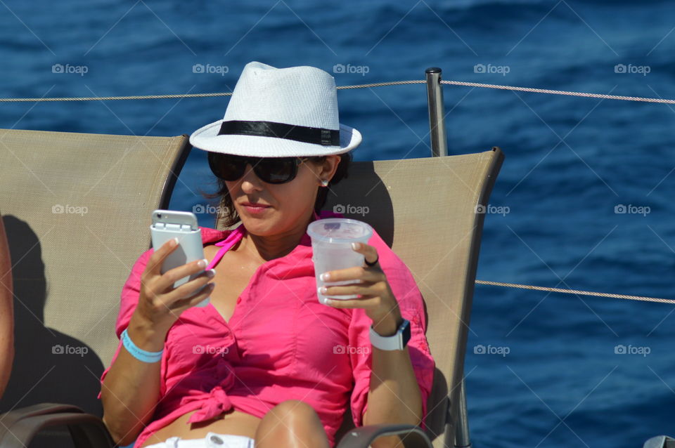 Sailing through life with the necessities - the beach, sun, and a beverage