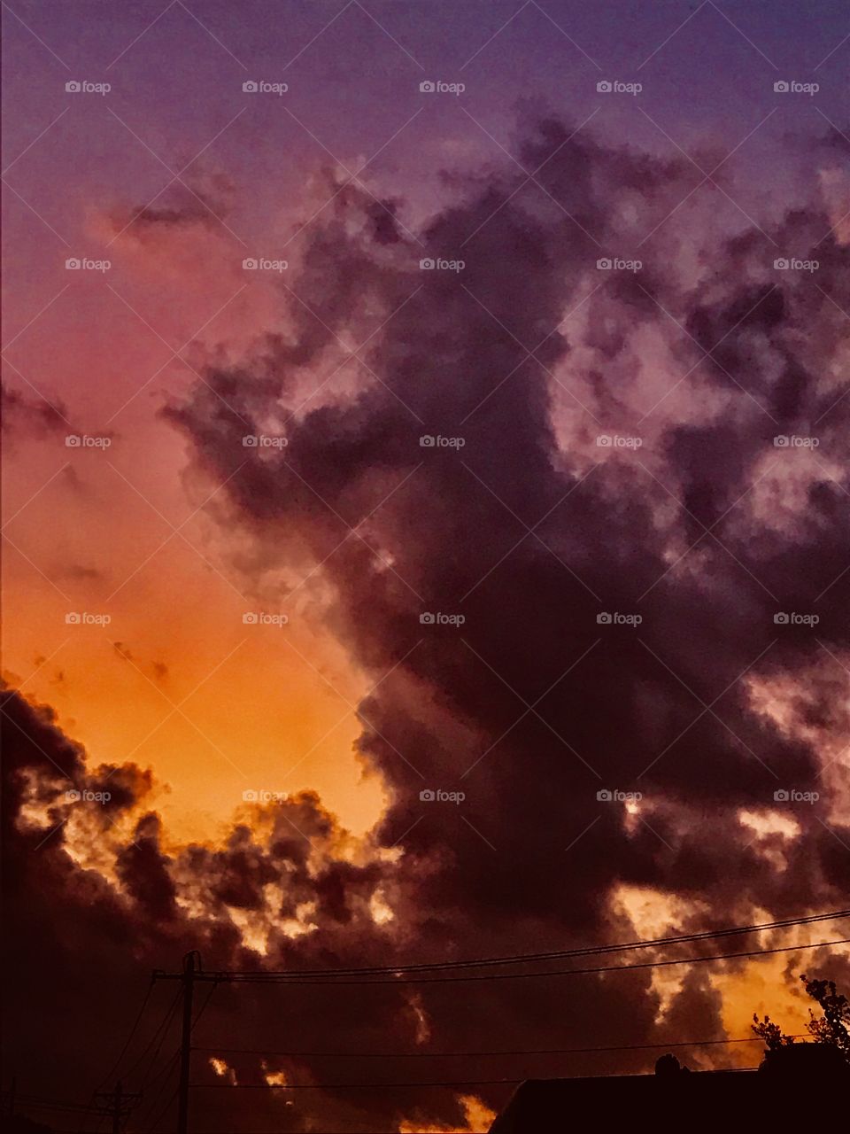 Cloud formation at Sunrise, cloud Figures at the base of cloud to left. All kinds of activities. Beautiful early morning colors. Everyone’s having a Party this AM.