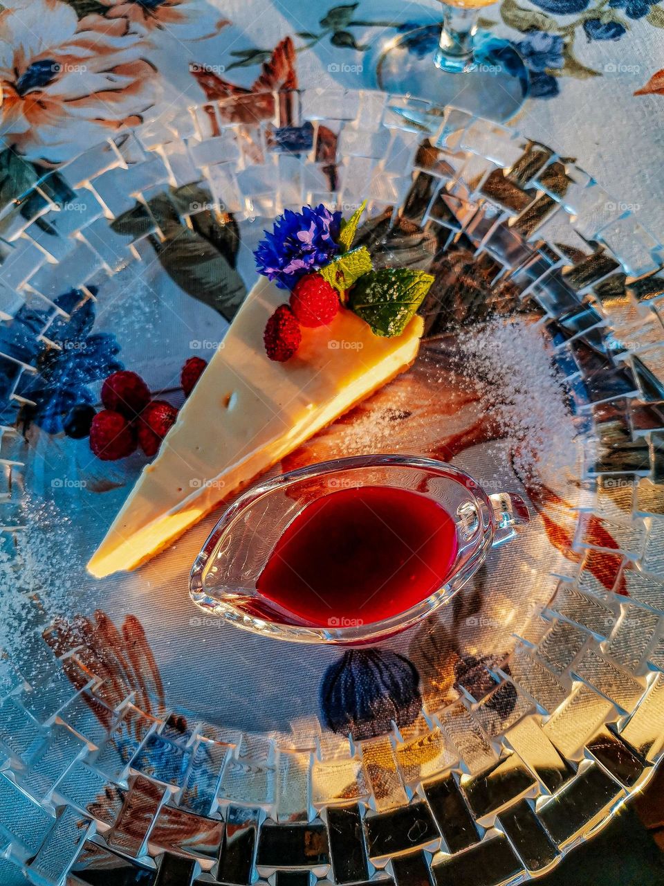 Gorgeous vivid and fresh desert with berries and flowers under the summer sunset light