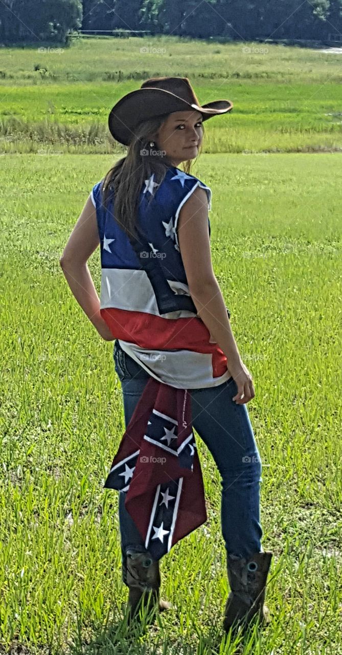 Mature Woman standing on grassy field