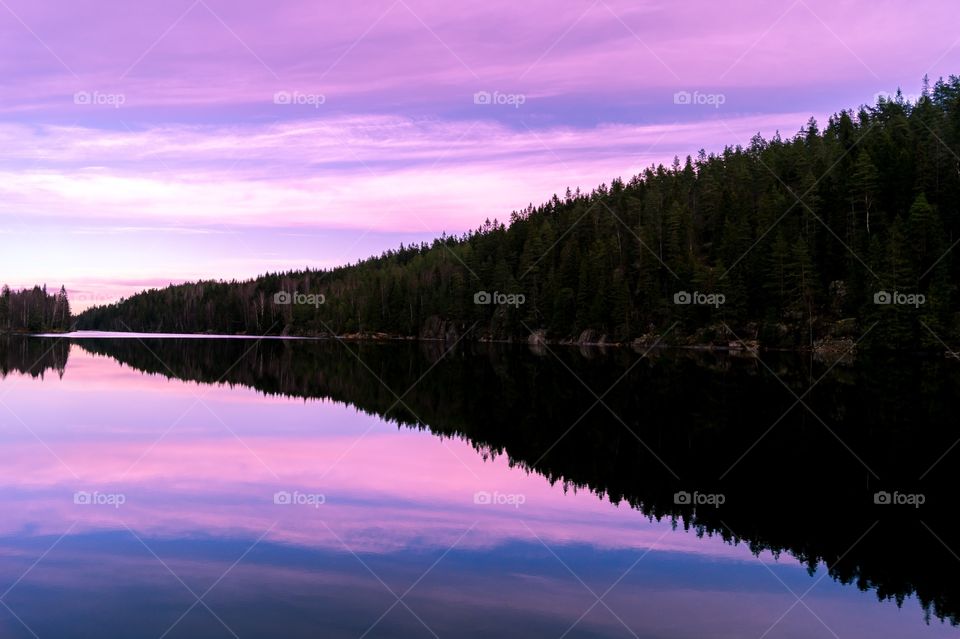 Dramatic sky reflecting on lake