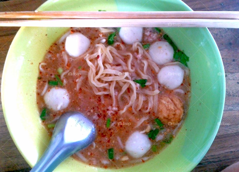 Egg noodle with fish balls in red soup "yentafo " sauce