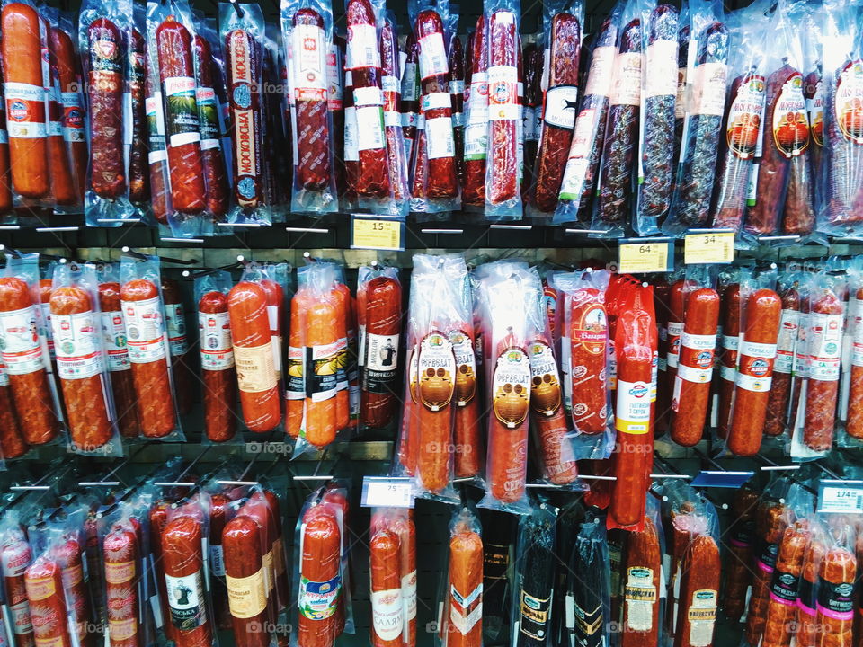 smoked sausage on the counter of the store