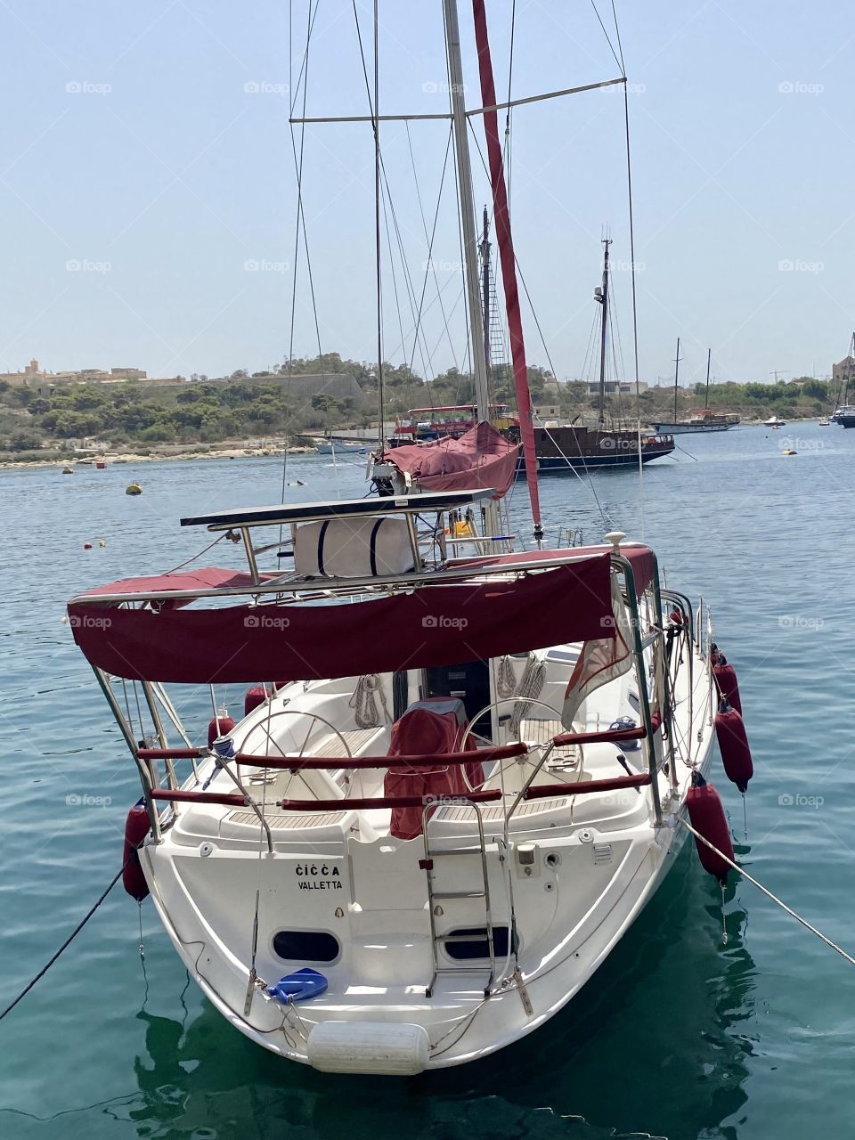 View of a sailboat moored in a bay in the Mediterranean Sea