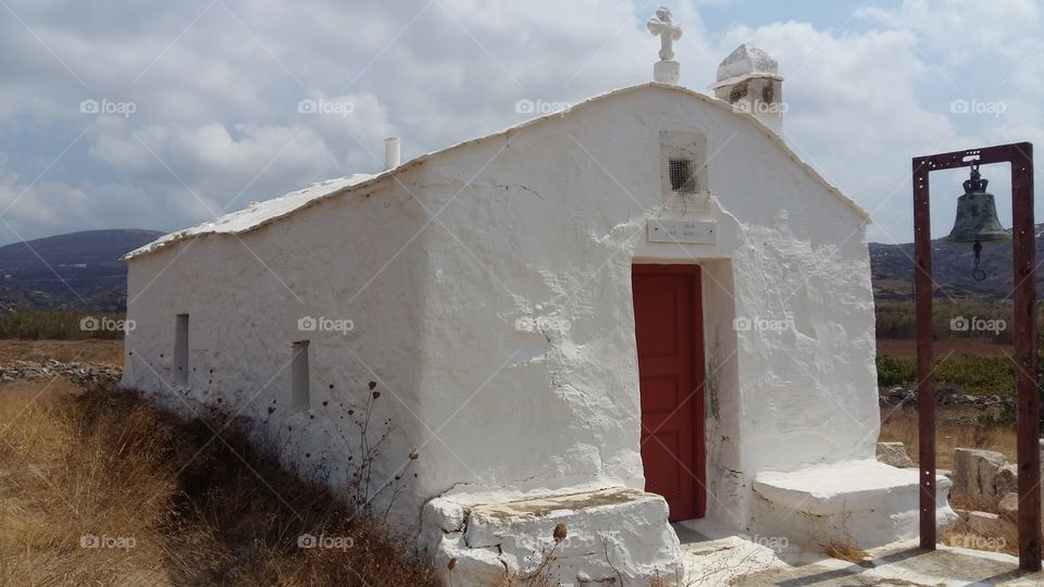 Traditional, old, whitewashed, humble church.
Perfect way to experience a spiritual trip to Christianity. 
The devout atmosphere will also witch the non believers.