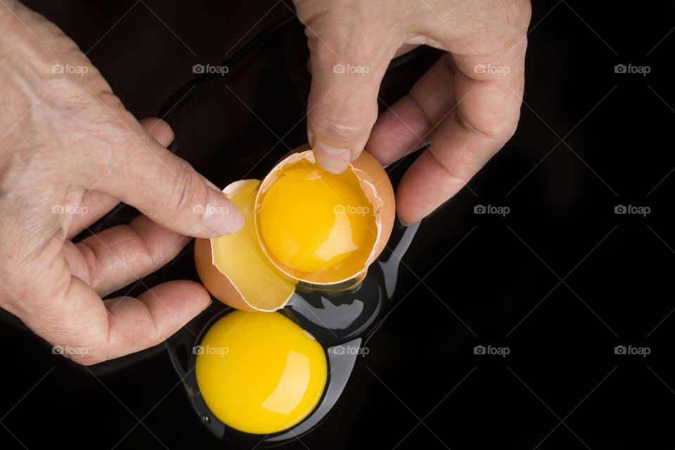 yellow yolk on black background.  close up. Top view