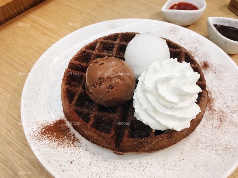 Chocolate waffle with chocolate and coconut ice cream
