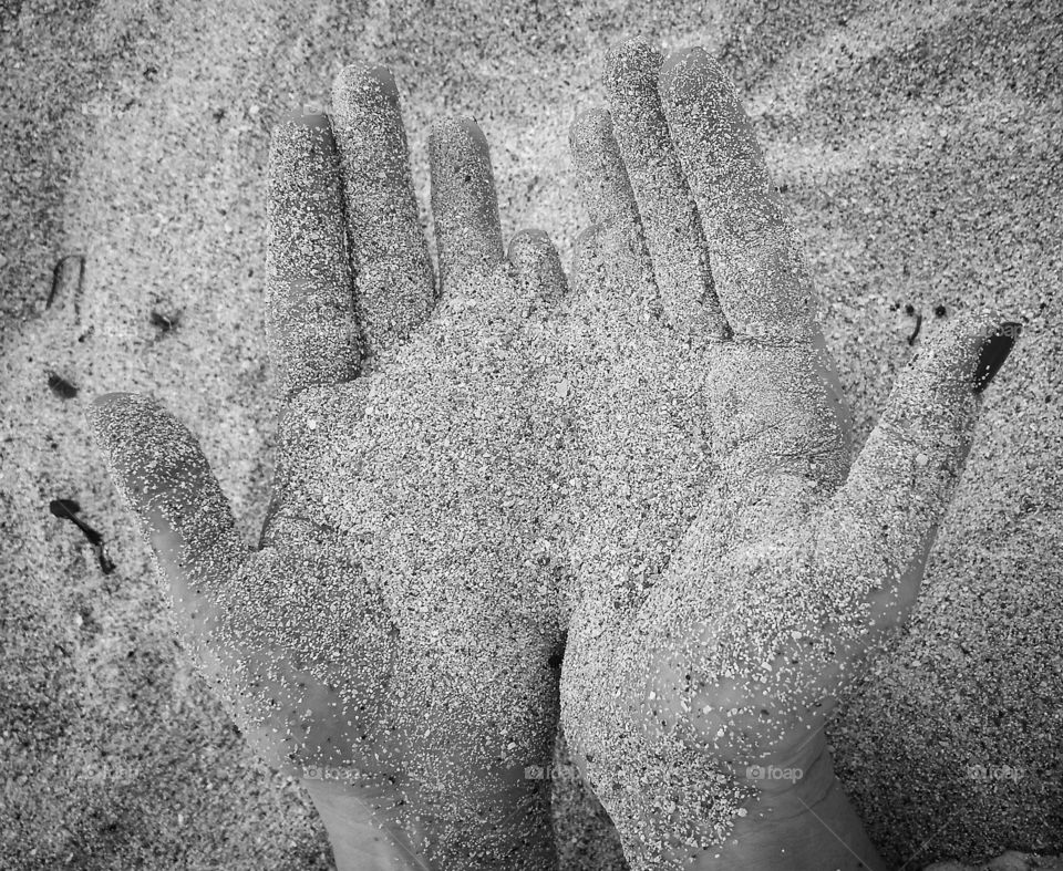 Hands in the sand