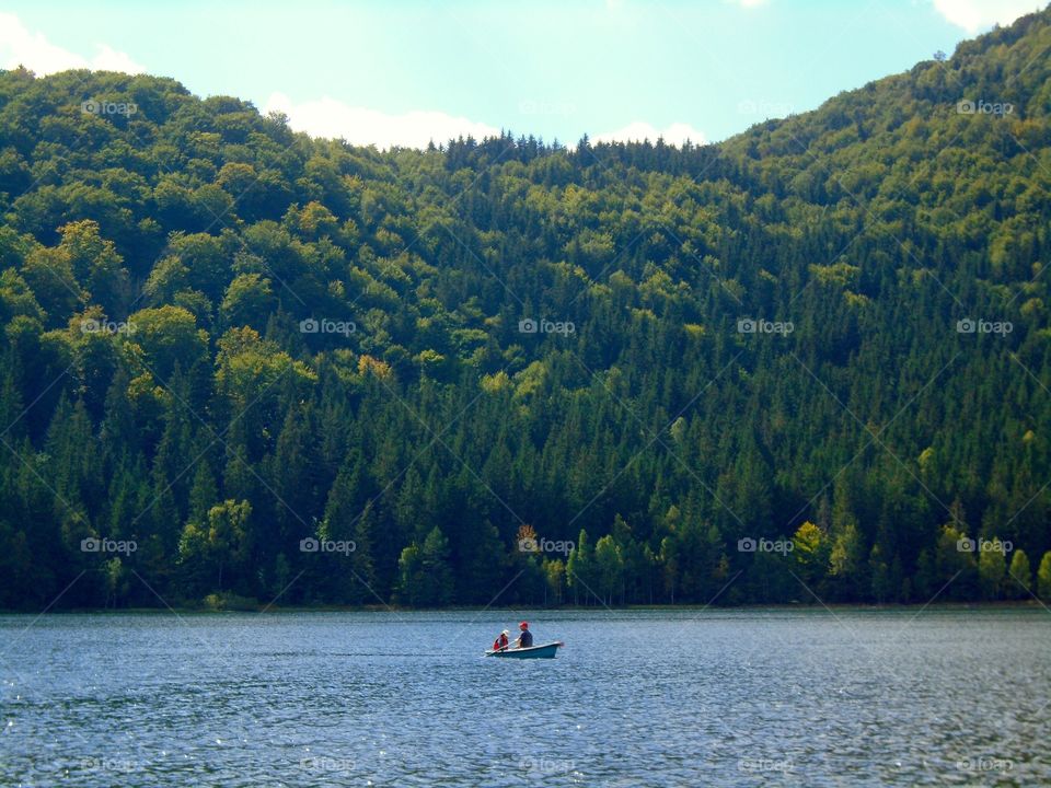 Boat sailing on the lake in Summer