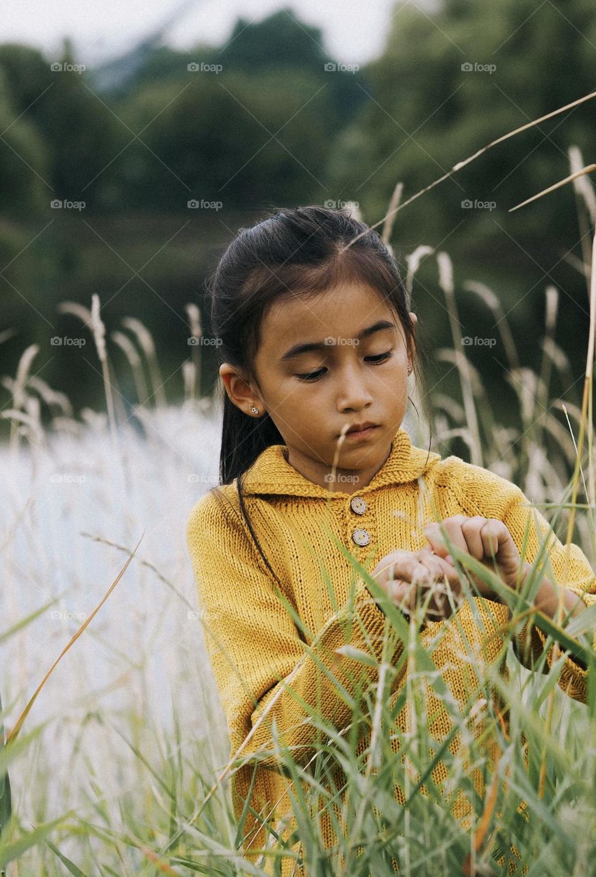 Portrait of cute little Asian girl 