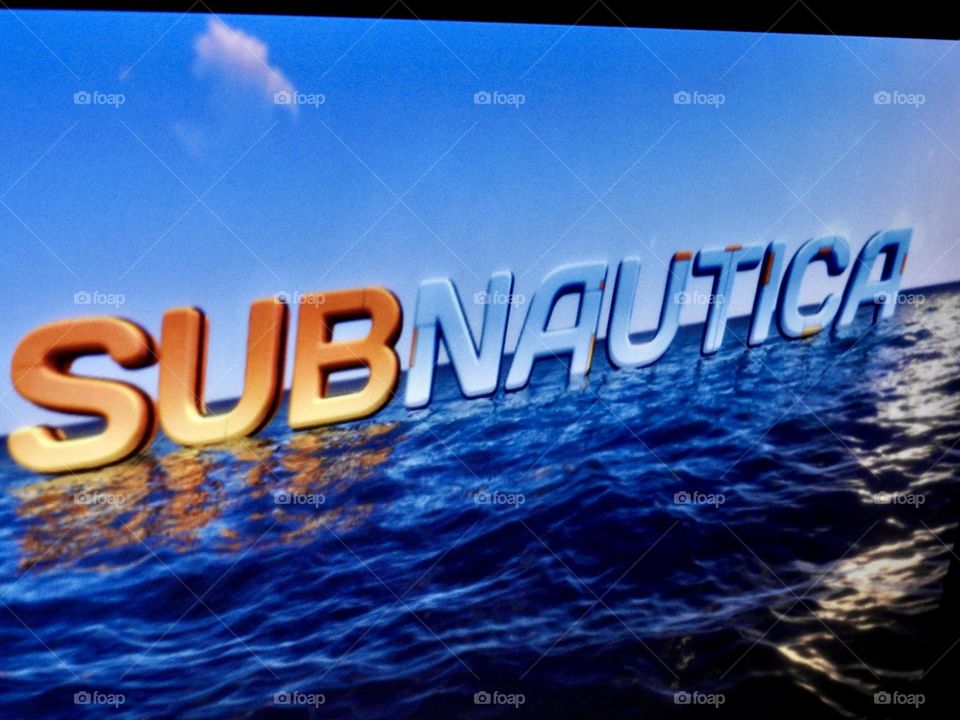 Video game photography taken of the game Subnautica from a gaming computer screen in a dark room at the start of the game.