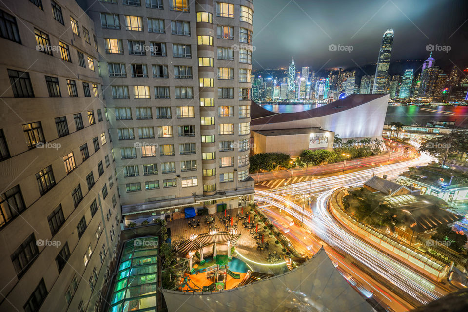 Hong Kong Night Cityscape with Traffic Lights Transportation and harbour view in long exposure