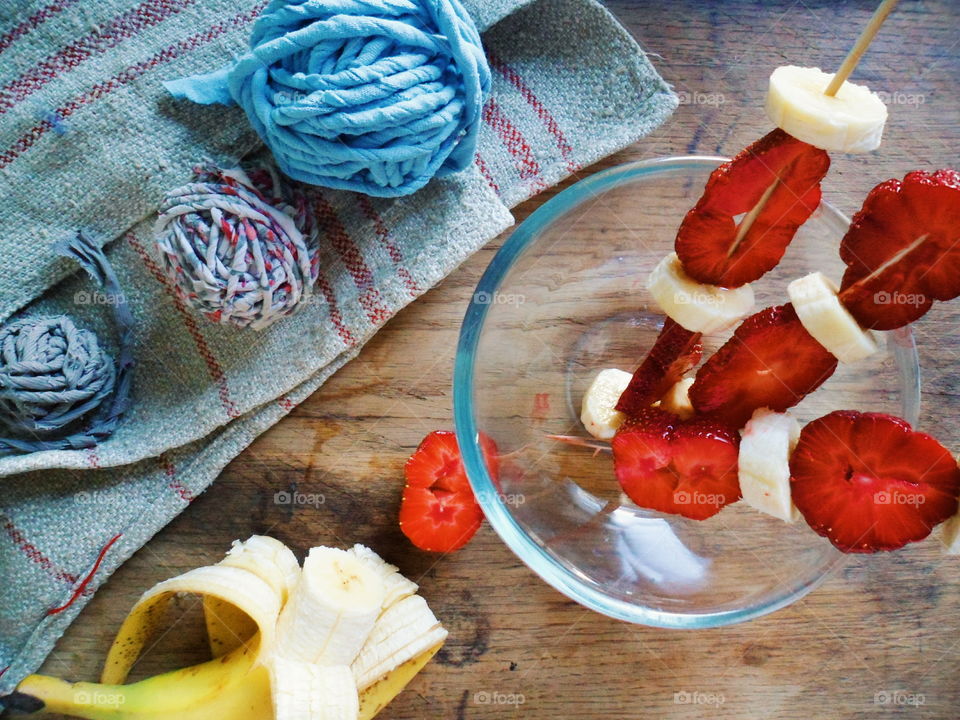 Fruit salad in bowl with thread