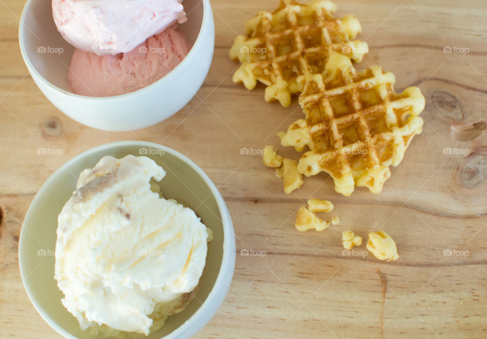 High angle view of strawberry and vanilla ice cream scoops