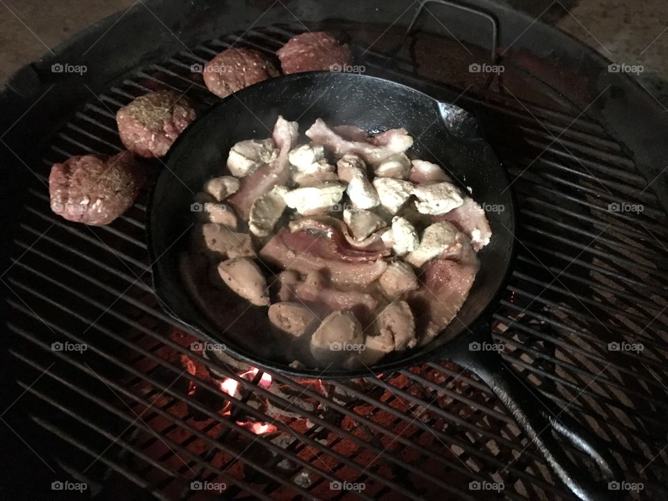 Out side grilling with a cast iron pan.